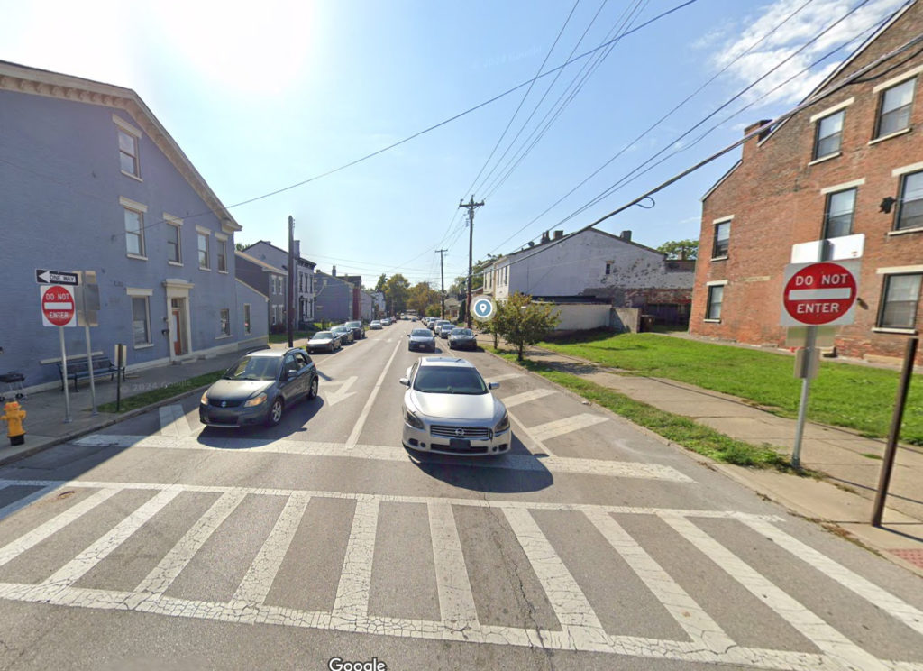 Intersection with two stopped cars